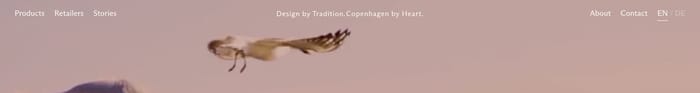 Jakobsen Copenhagen header: left links, centered slogan, right About Contact EN/DE over a bird photo