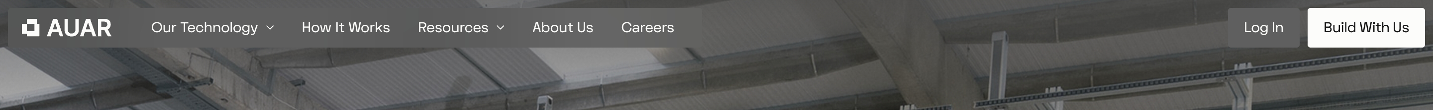 Automated Architecture navigation bar with AUAR logo, links, Log In and Build With Us over an industrial ceiling photo