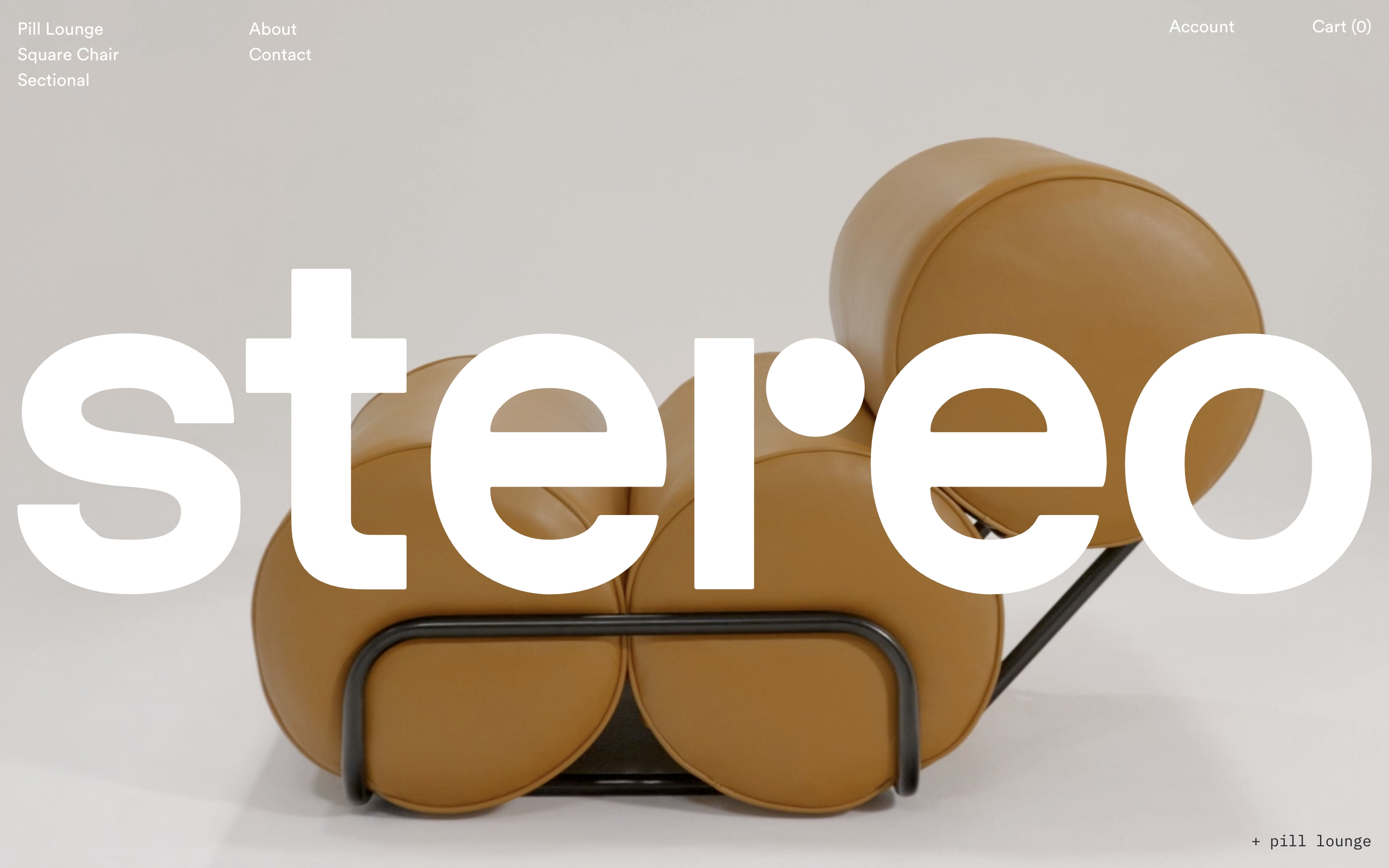 Stereo Furniture hero: oversized white stereo wordmark over a tan leather Pill Lounge on a light studio background