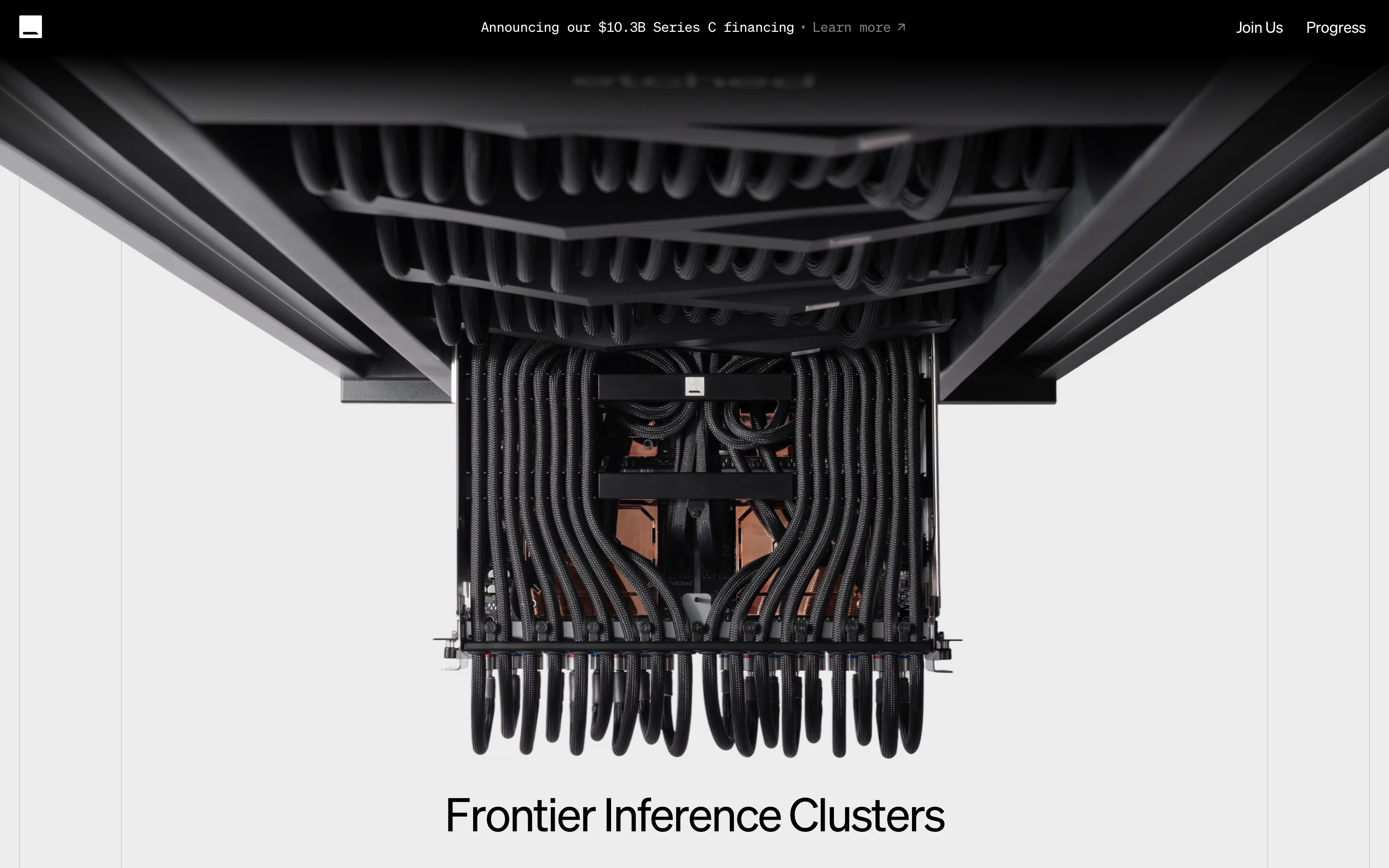 Etched hero with a top-down photo of a black-cabled hardware unit and the headline Frontier Inference Clusters