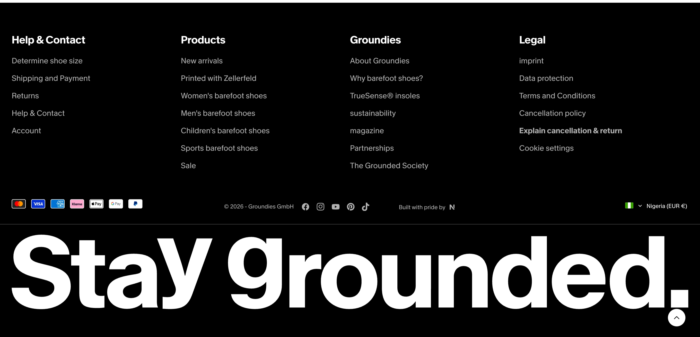 Groundies footer with four sitemap columns, payment and social row, and oversized Stay grounded. type on black