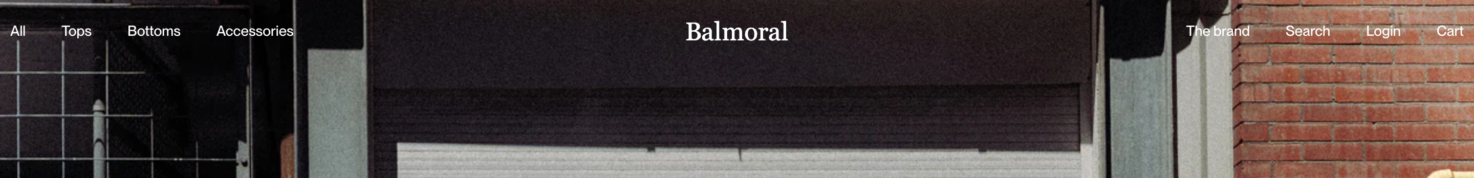 Balmoral Running header with centered serif logo and white links over a brick and shutter photo.