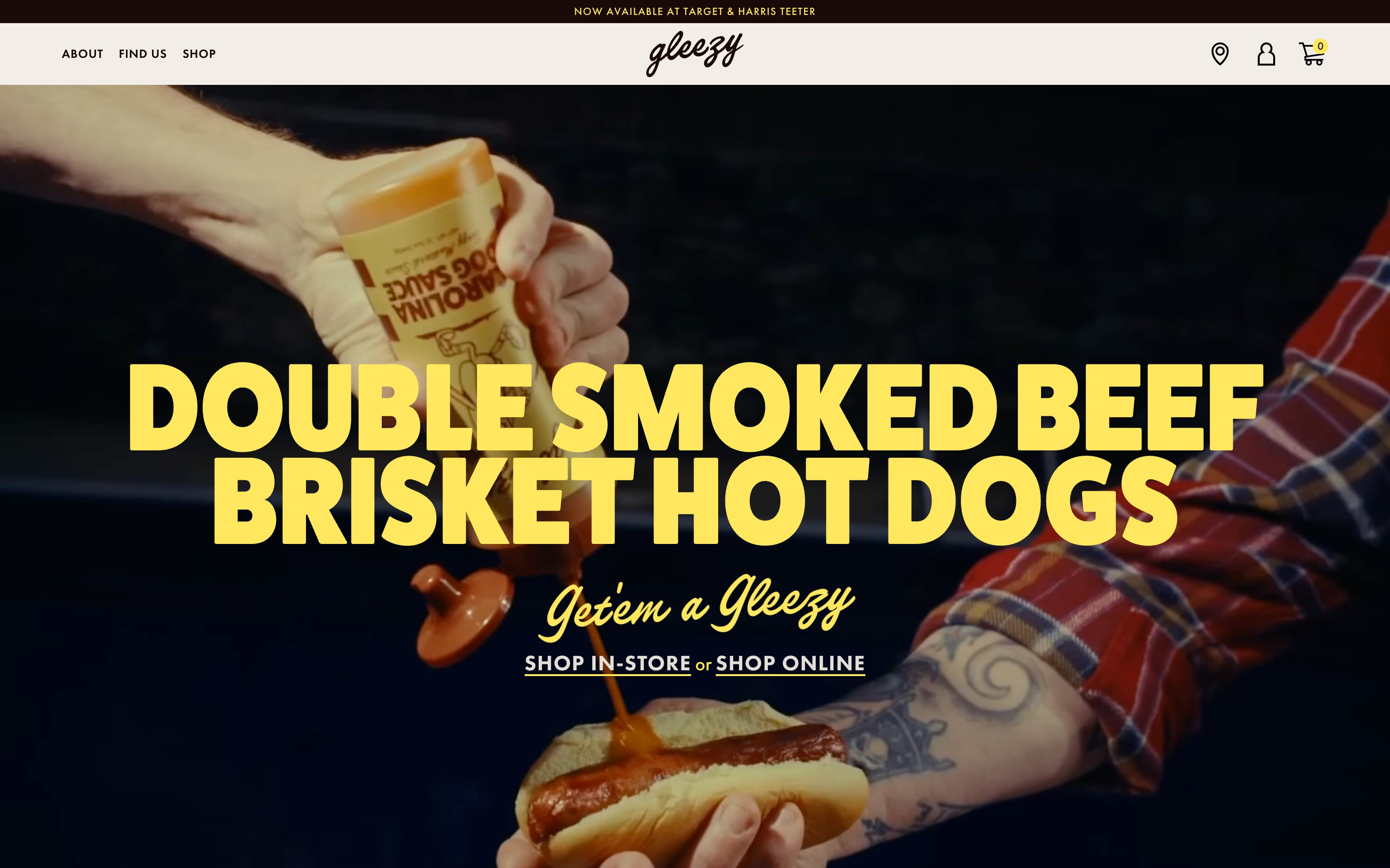 Gleezy hero with yellow brisket hot dog headline over a photo of sauce poured onto a bun