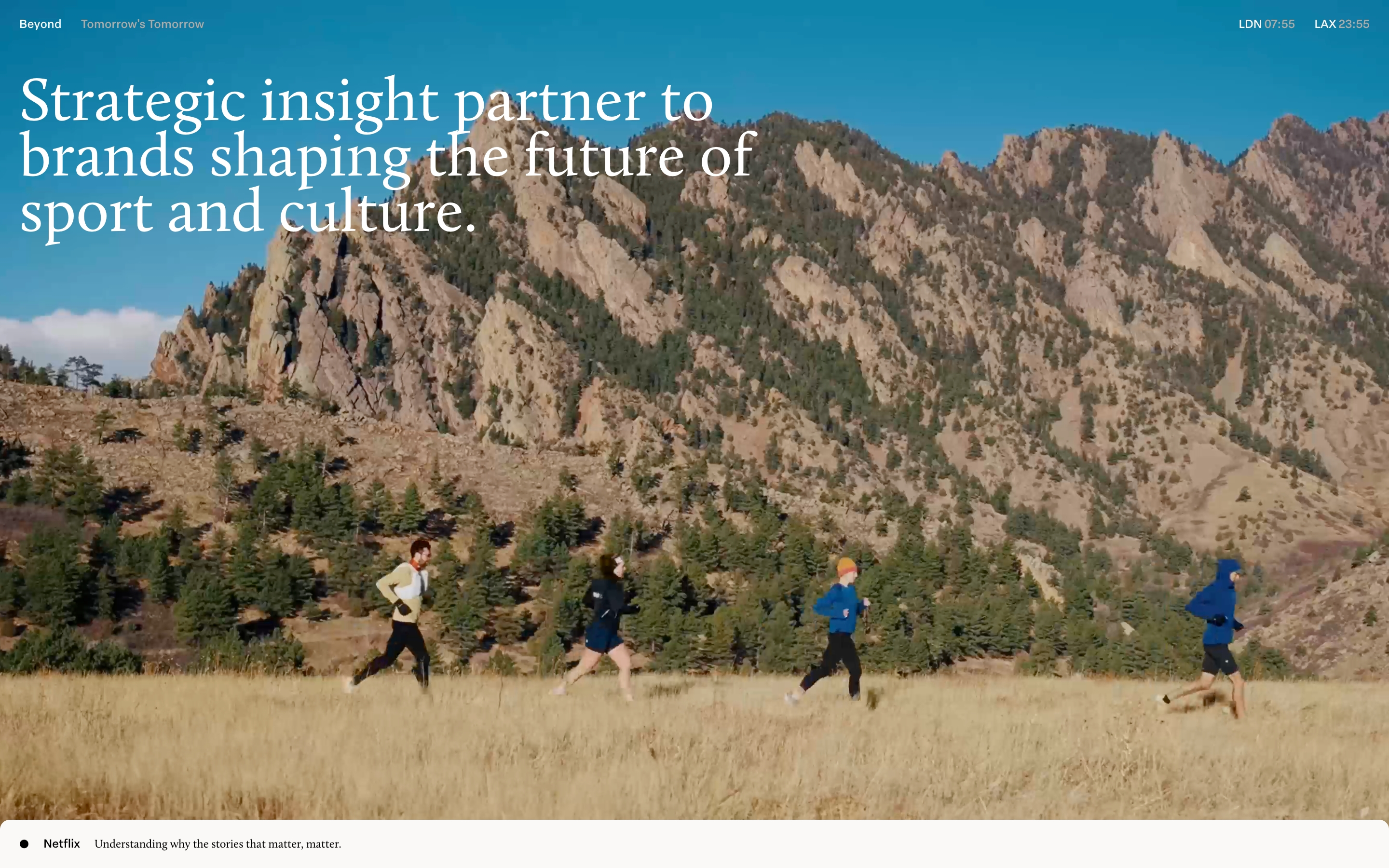 Studio Beyond hero with oversized white serif headline over mountain runners and a Netflix caption bar.