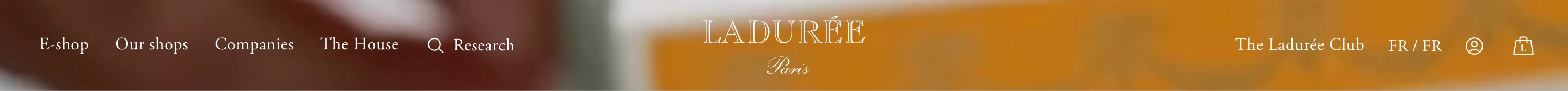 Ladurée header: blurred pastry photo, centered LADURÉE Paris wordmark, left links, right club and bag icons.