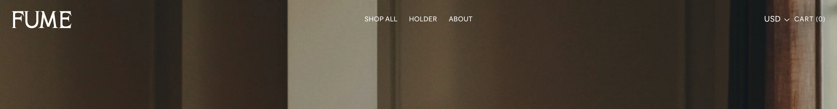 Fume header with FUME wordmark, centered Shop All, Holder, About links, and USD cart over a dark interior photo